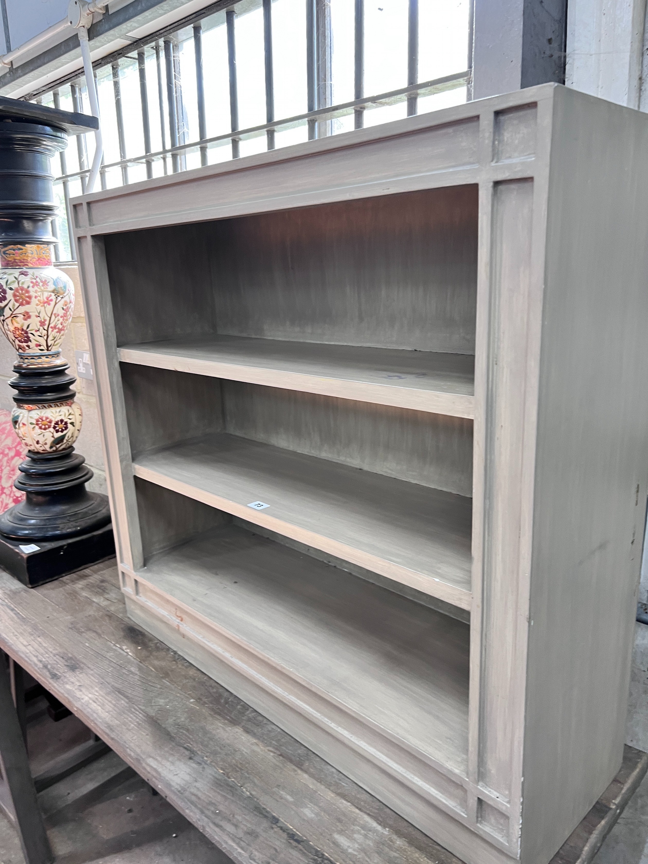 A contemporary painted open three-shelf bookcase, width 90cm, depth 28cm, height 83cm *Please note the sale commences at 9am.